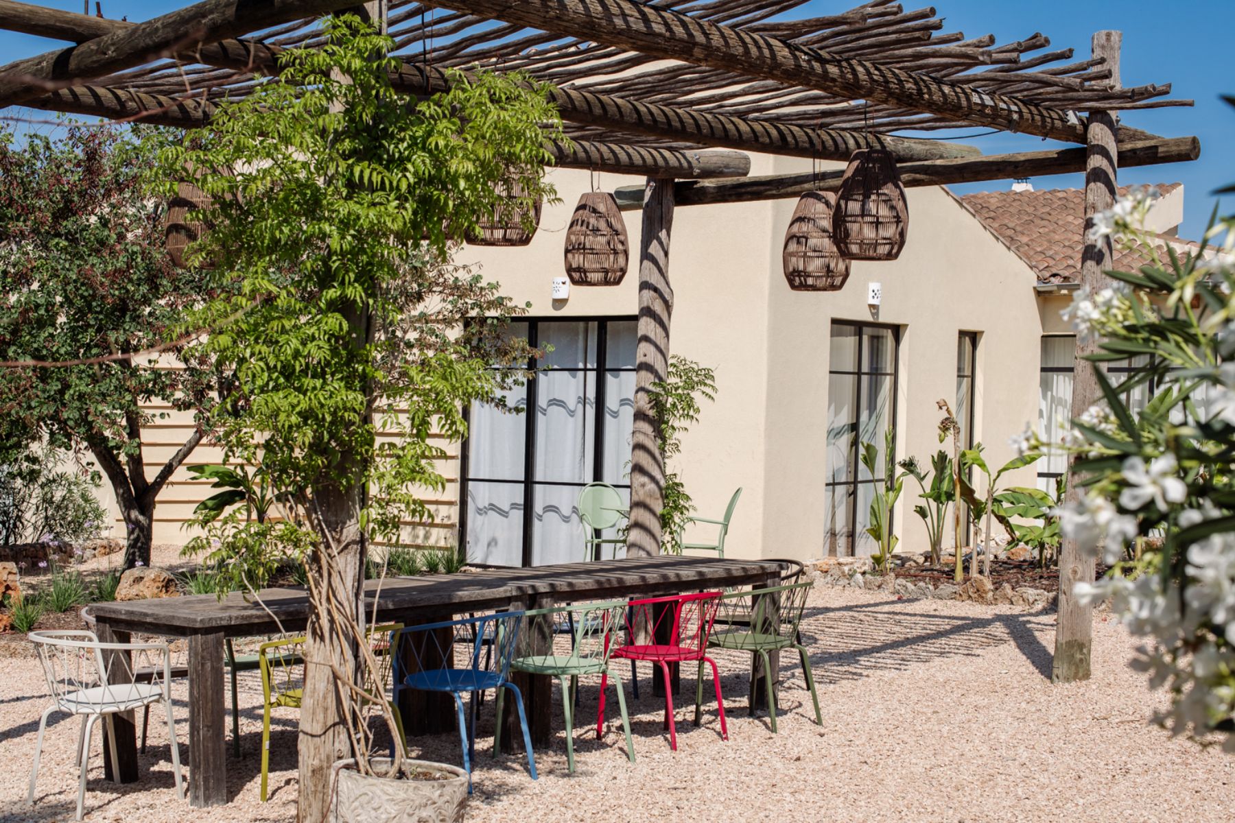 Outdoor dining terrace and garden at Finca Romani, Mallorca
