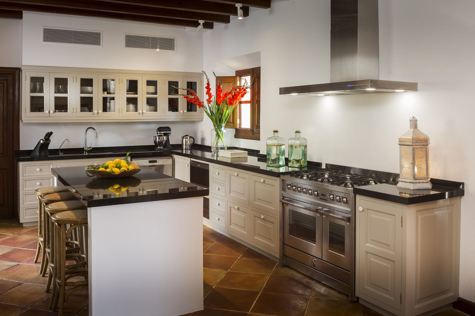Fully equipped kitchen with breakfast island at Sa Terra Rotka, luxury island in Mallorca
