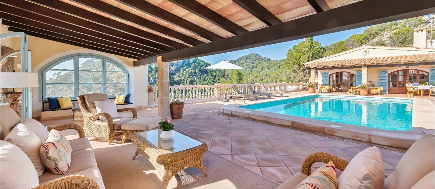 Pool and terrace with seating at Villa Canyamel