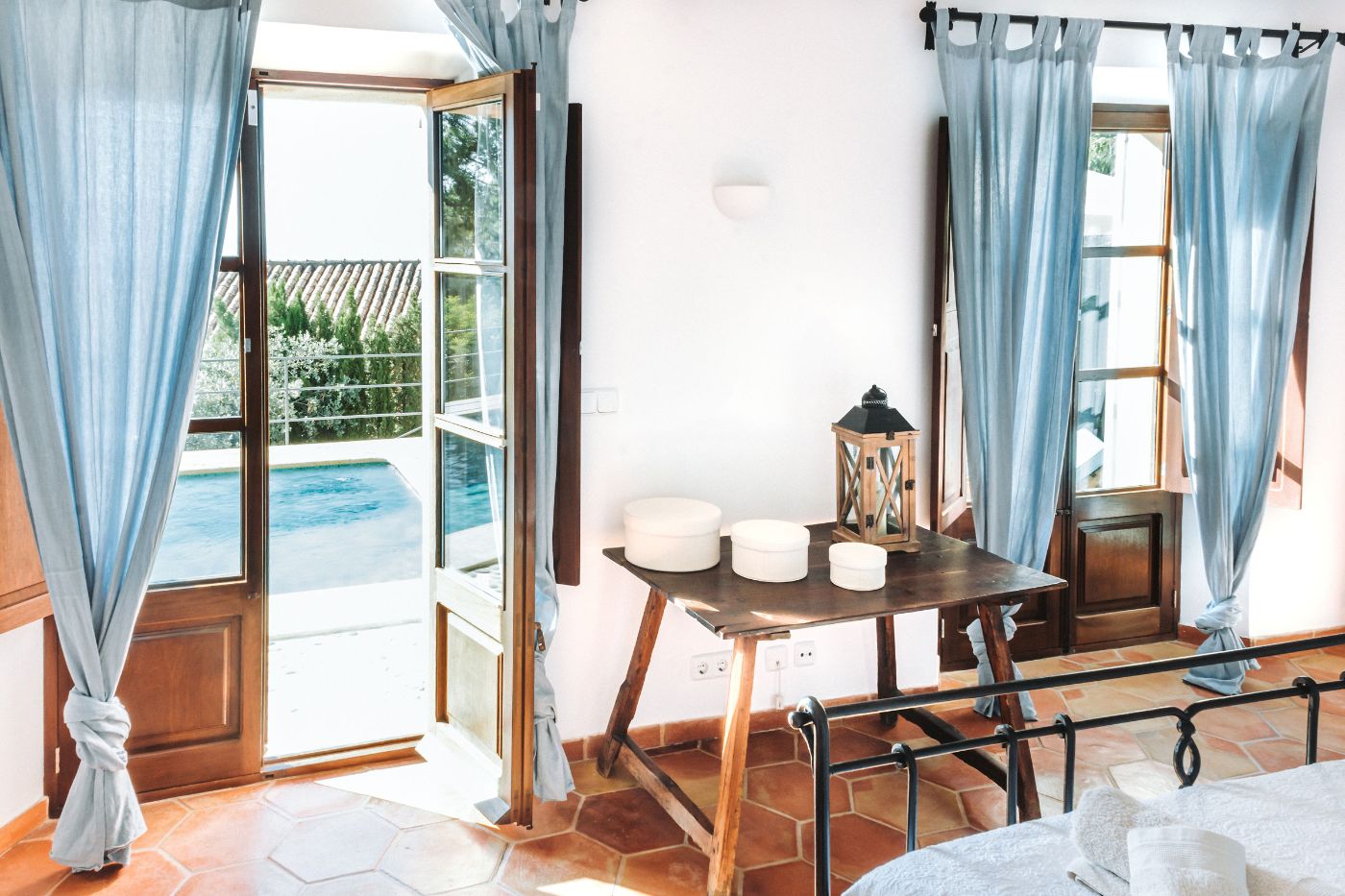 Bedroom with pool view at Villa Cascada