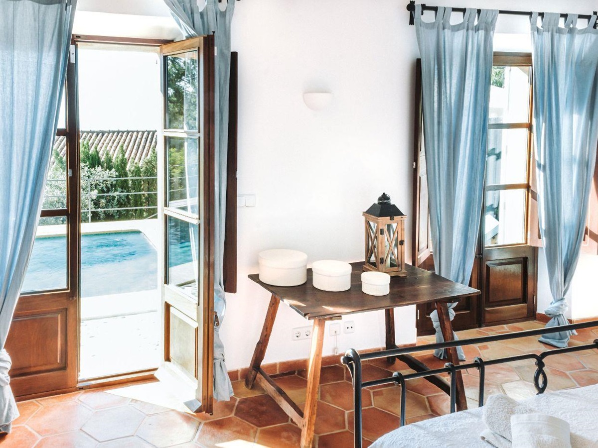 Bedroom with pool view at Villa Cascada