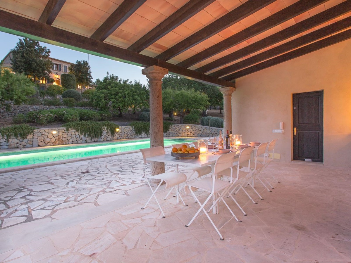 Dining area next to pool at Villa Maria, Mallorca