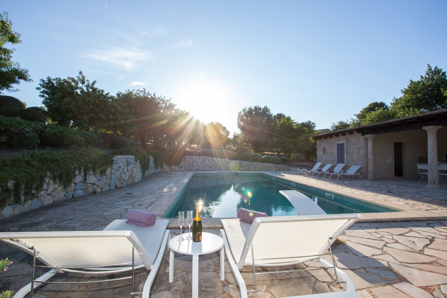 Pool with sun loungers at Villa Maria, Mallorca