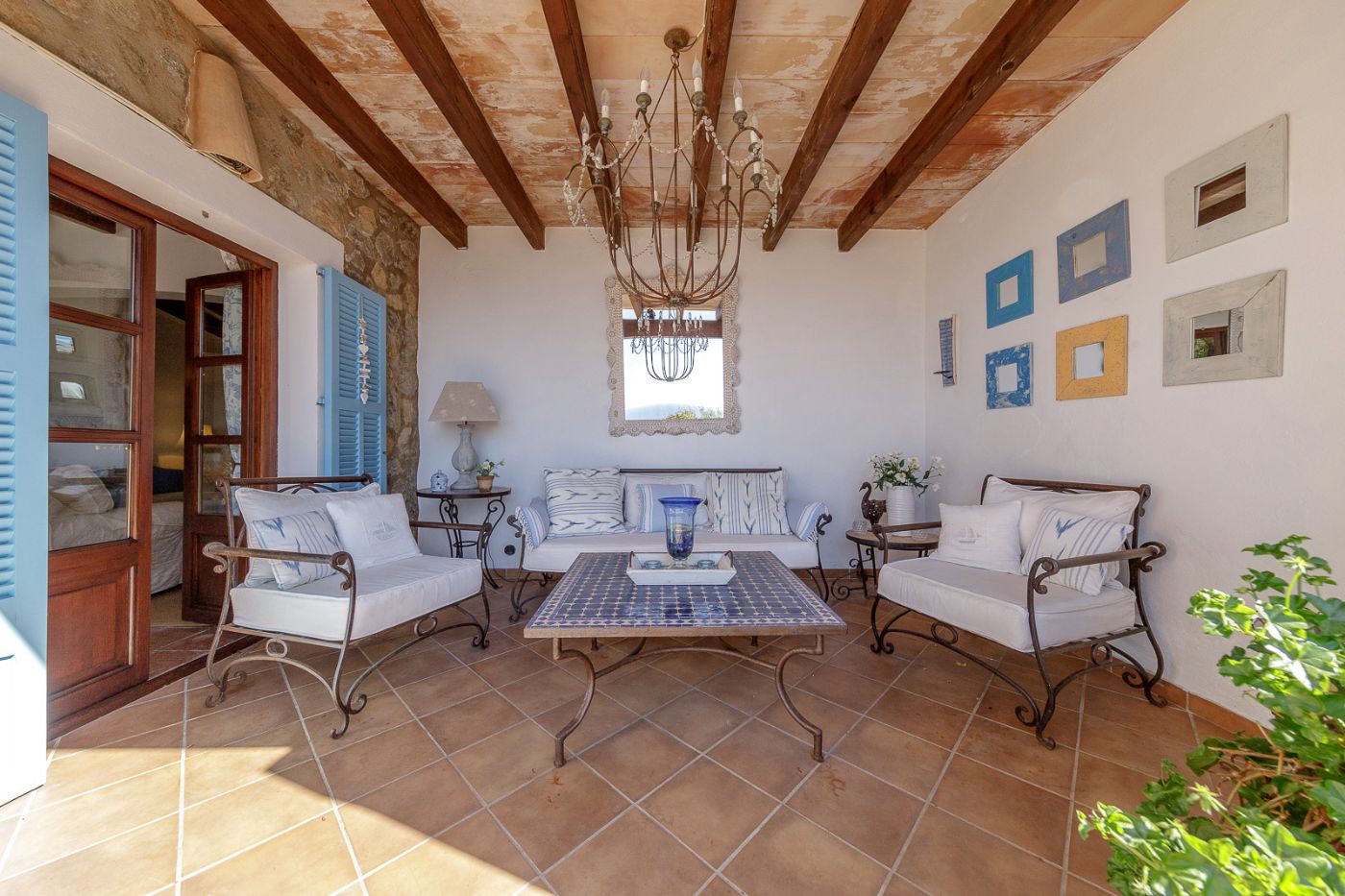 Covered terrace with seating at Villa Mariposa
