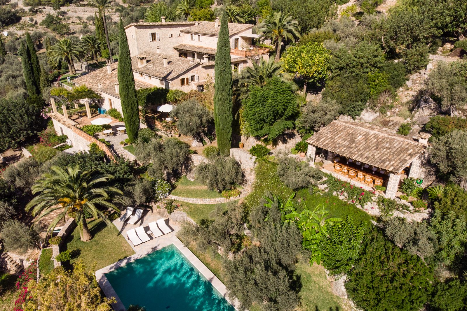 an aerial view of the pool and the villa
