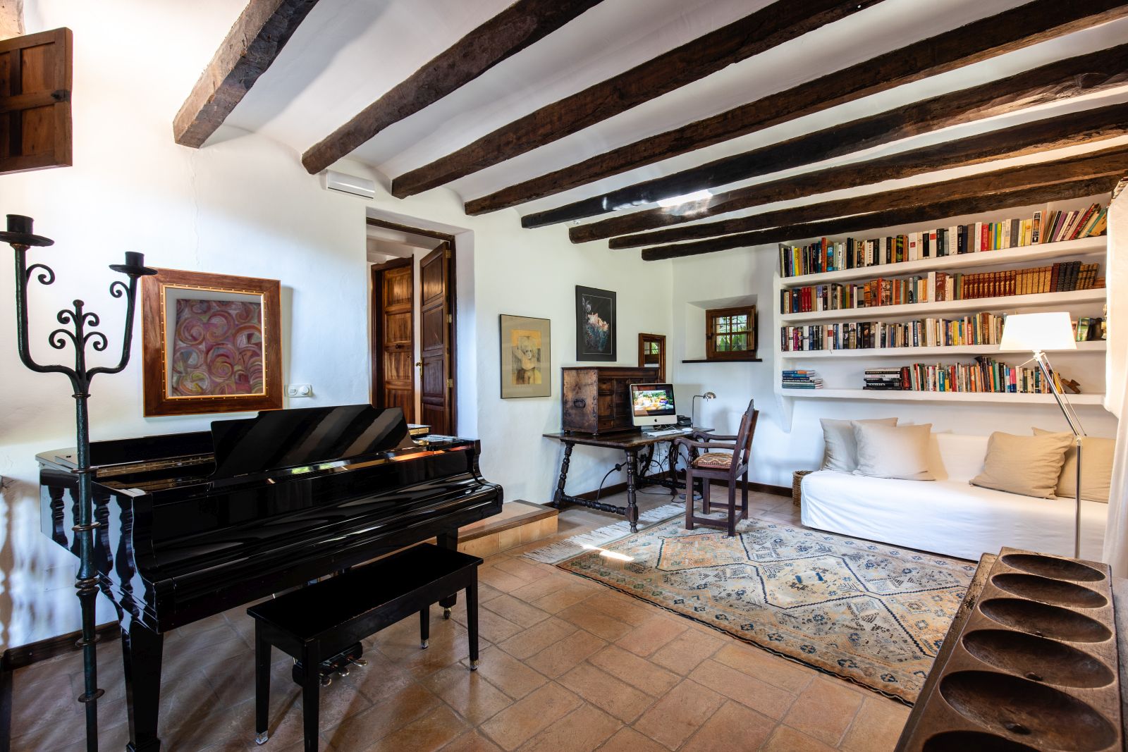 a view of the piano and the library