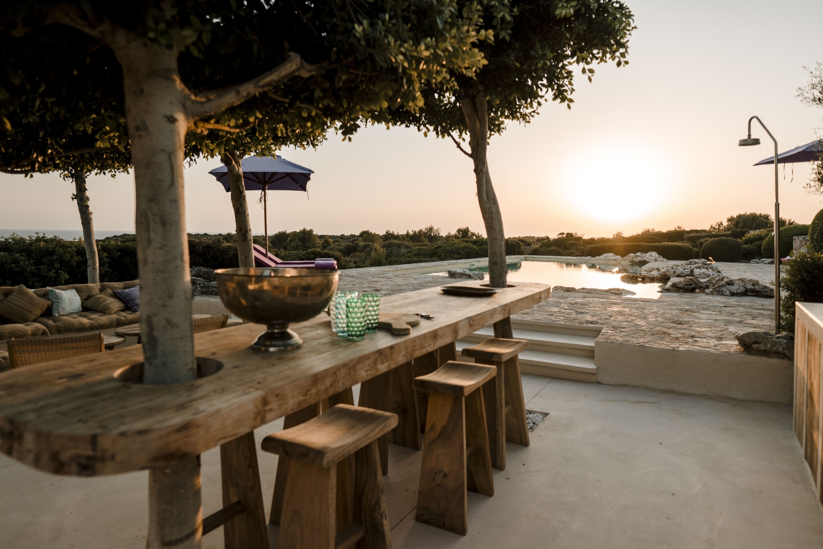 Bar-style seating by the pool at Menorcan luxury villa Binicalaf