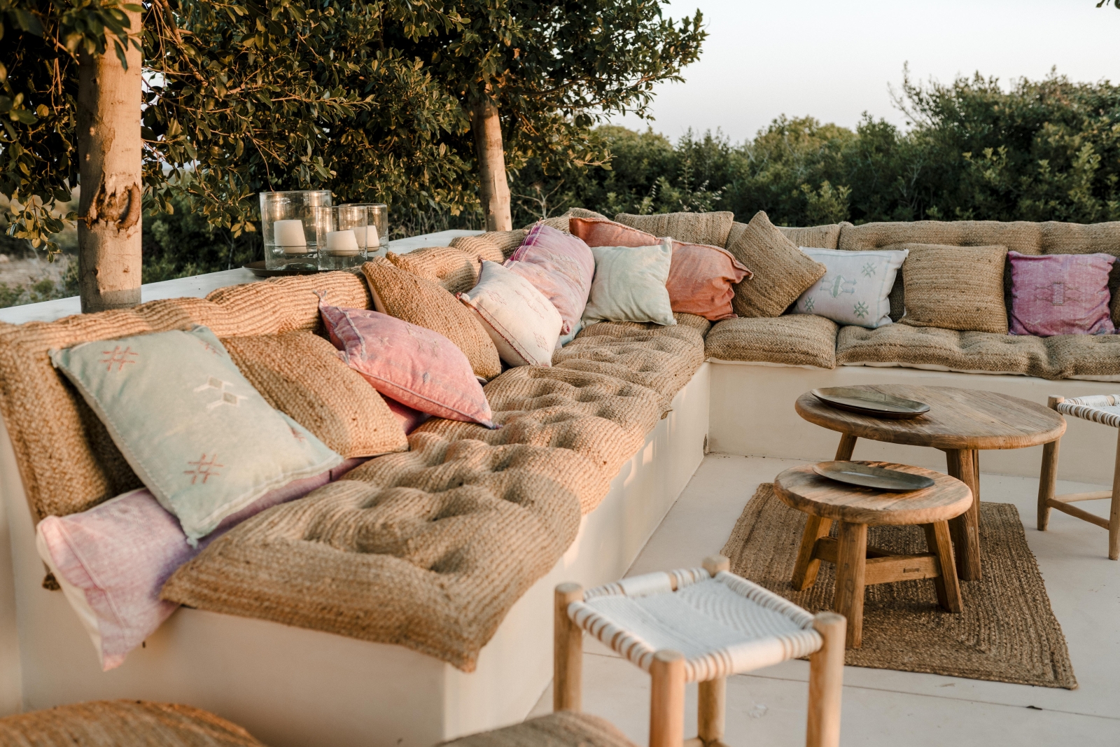 Comfortable outdoor seating area at luxury villa Binicalaf at sunset