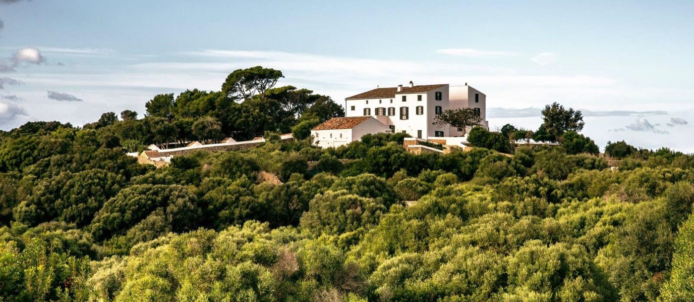 panoramic view of at luxury villa Casa Benedicta in Menorca surrounded by trees and green shrubs