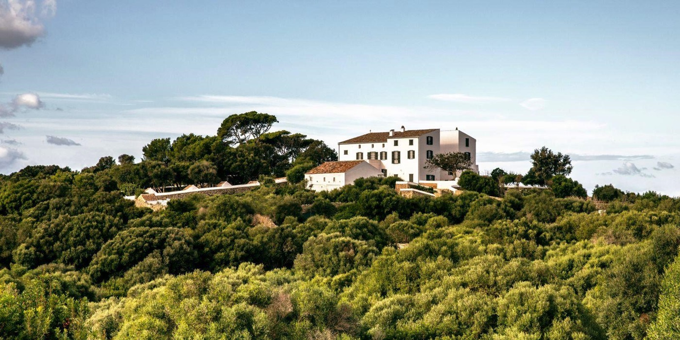 panoramic view of at luxury villa Casa Benedicta in Menorca surrounded by trees and green shrubs