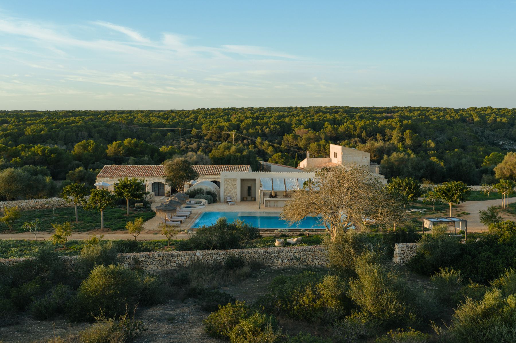 View of pool and gardens at Villa Solana, Menorca