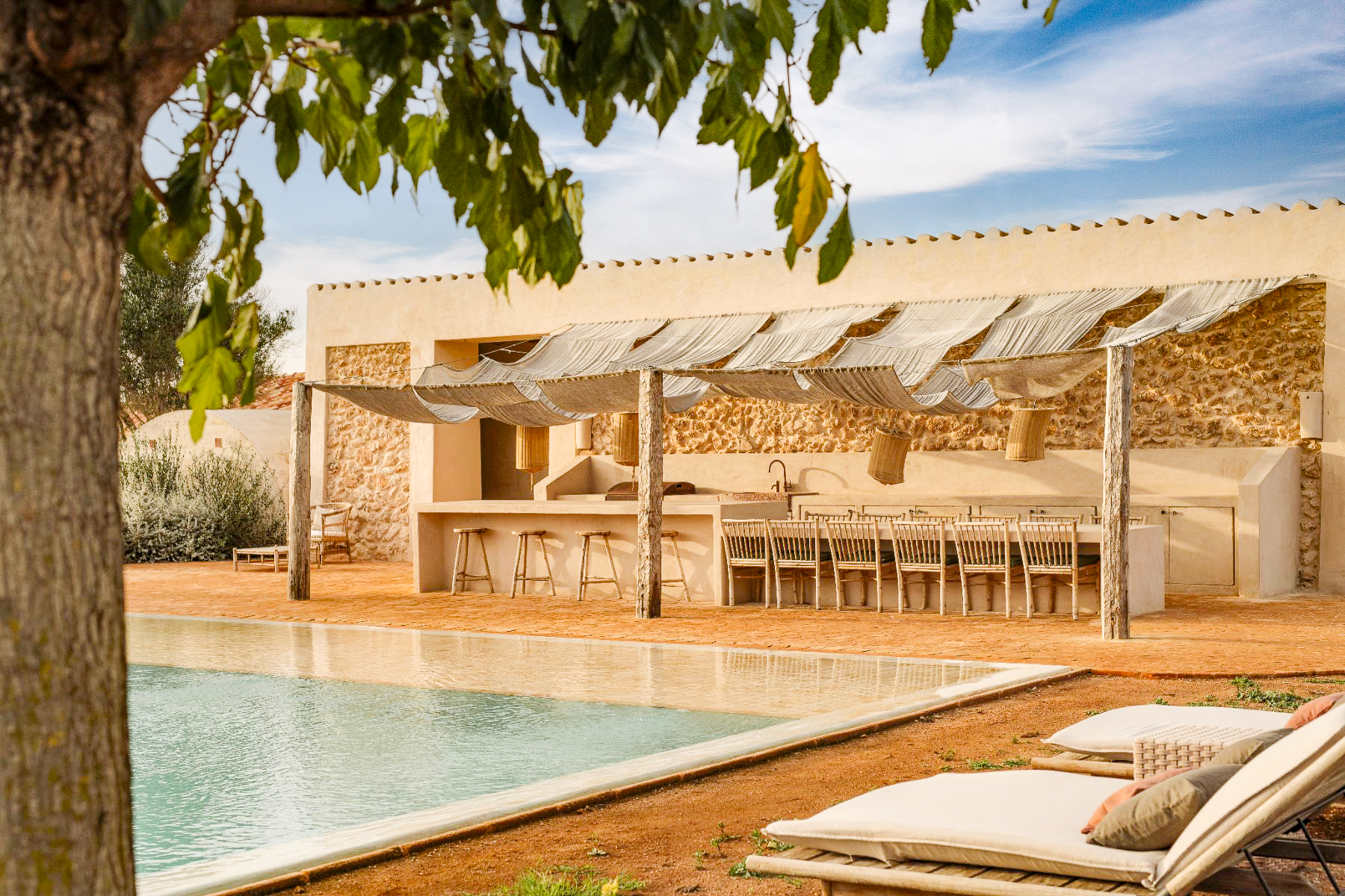 Poolside dining area at Villa Solana in Menorca
