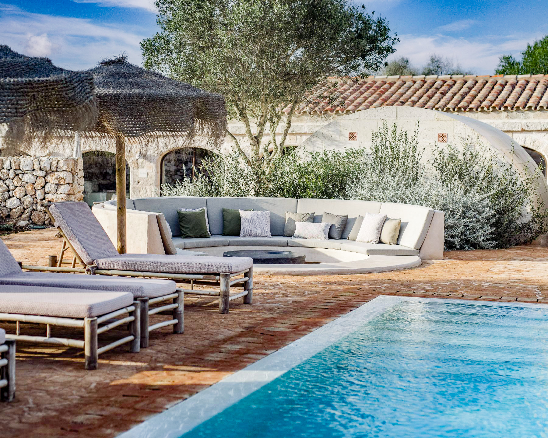 Swimming pool seating area at Villa Solana in Menorca