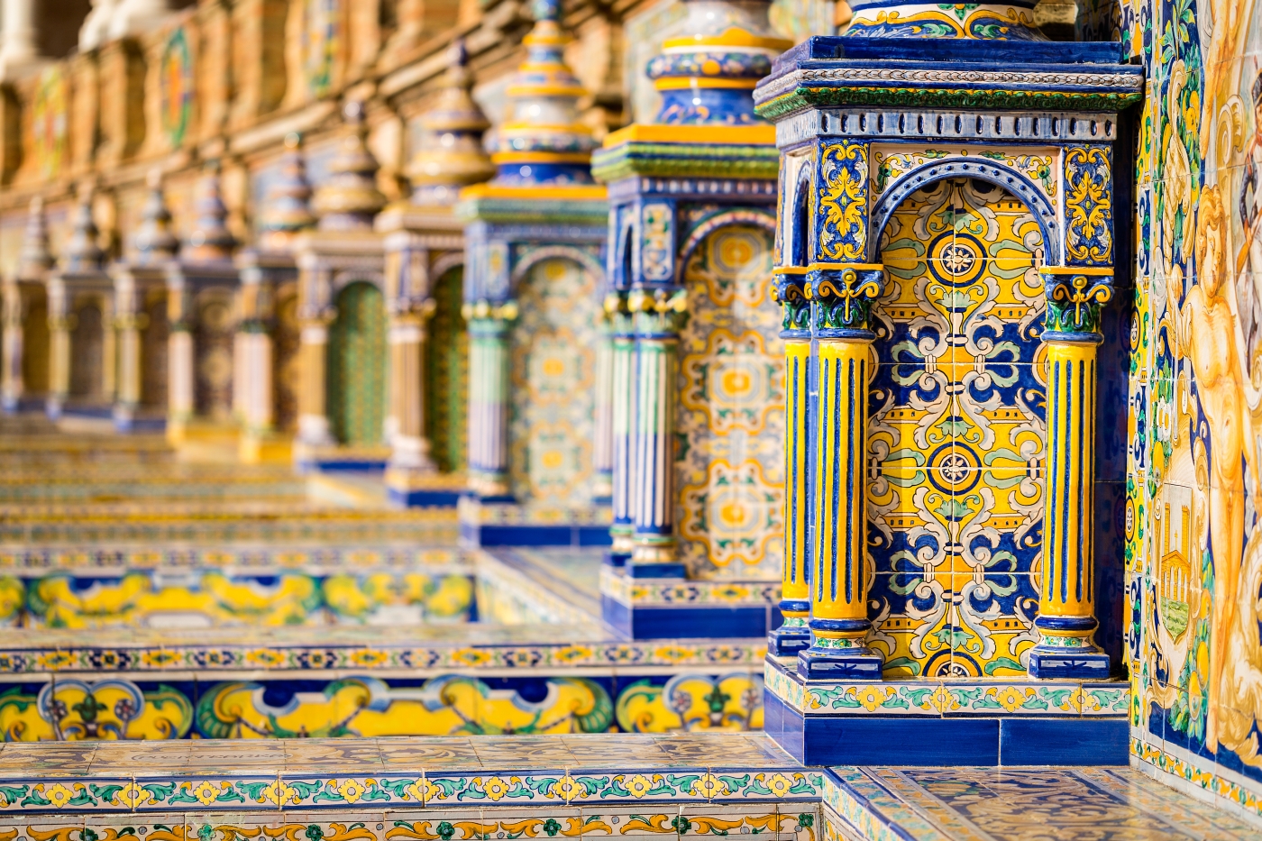 Bright tiled walls at Plaza de Espana in Seville, Spain