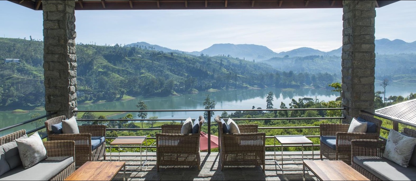 A view of the river with mountains in the background from the veranda at Camelia Hill tea bungalow in Sri Lanka 