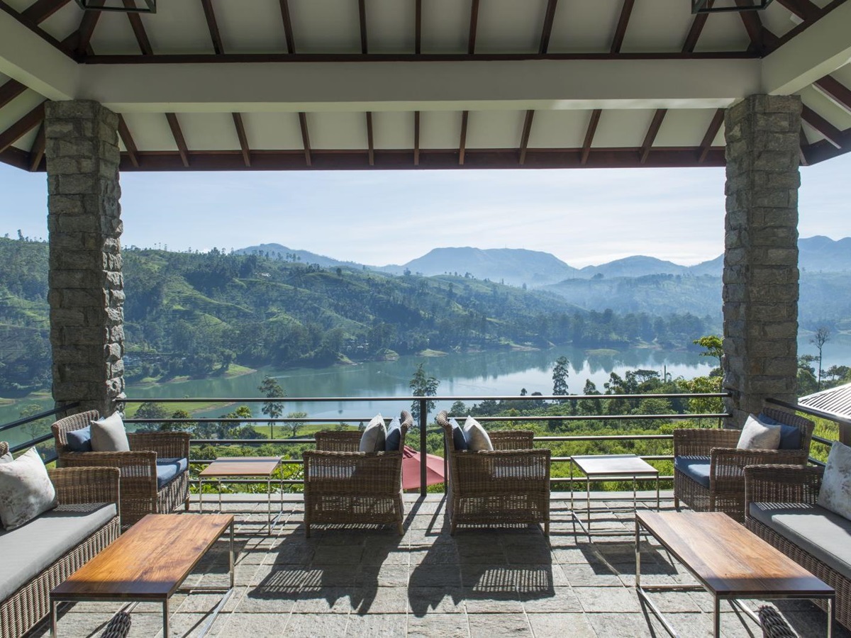 A view of the river with mountains in the background from the veranda at Camelia Hill tea bungalow in Sri Lanka