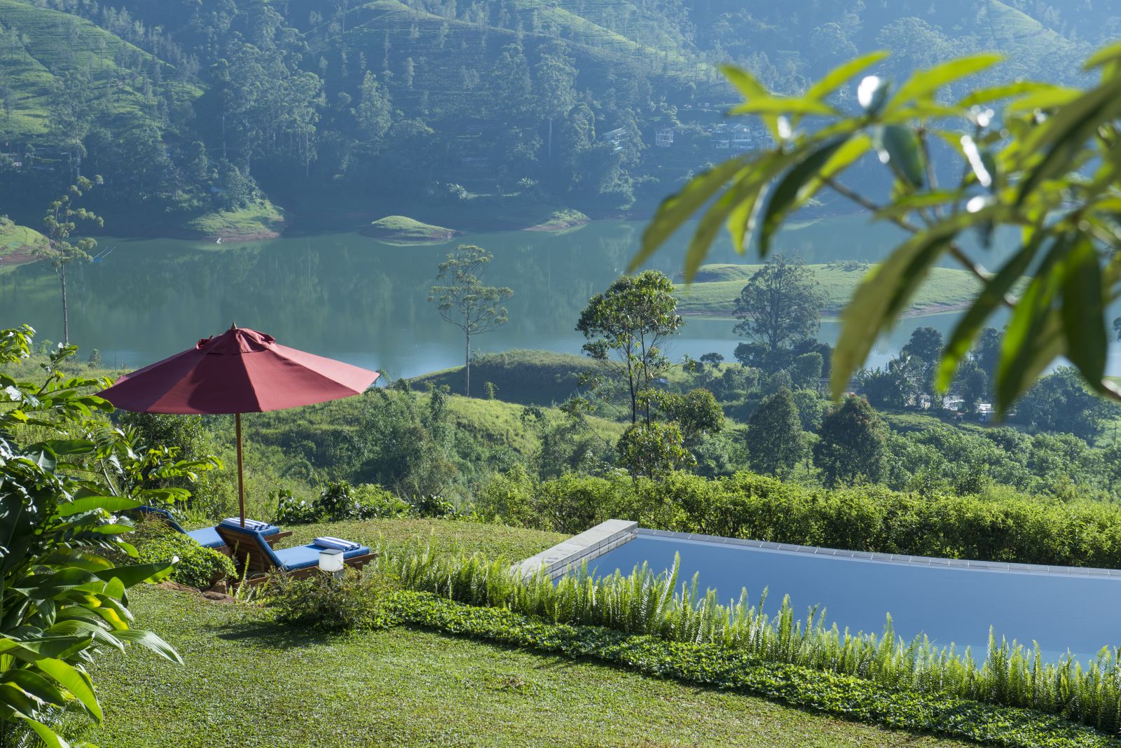 Pool and lake view at Camelia Hills hotel Sri Lanka