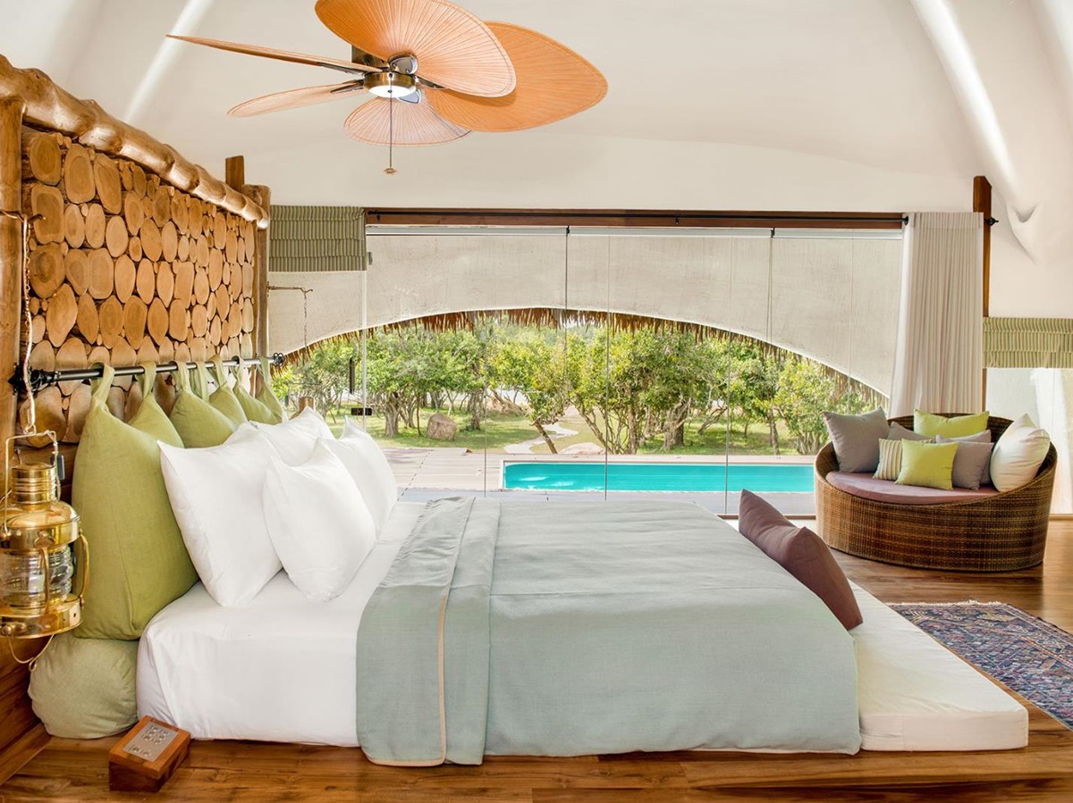 Guest suite bedroom at Chena Huts in Yala National Park in Sri Lanka