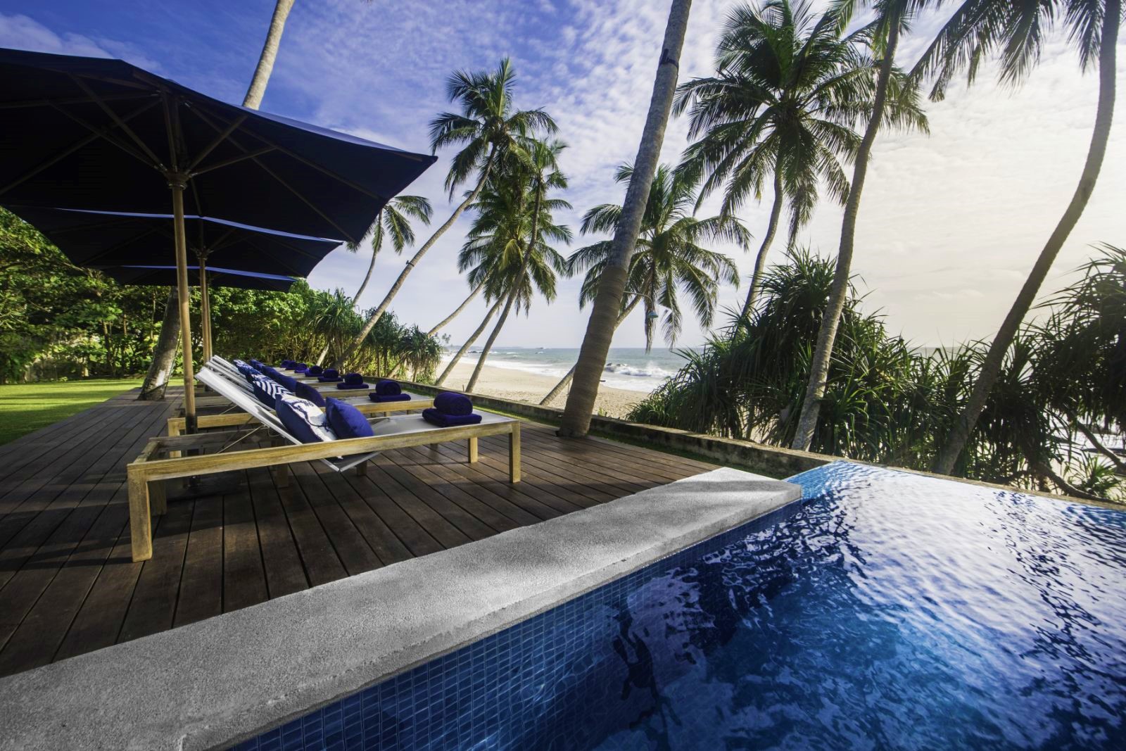 Poolside sunbeds at Kumu Beach on the south coast of Sri Lanka