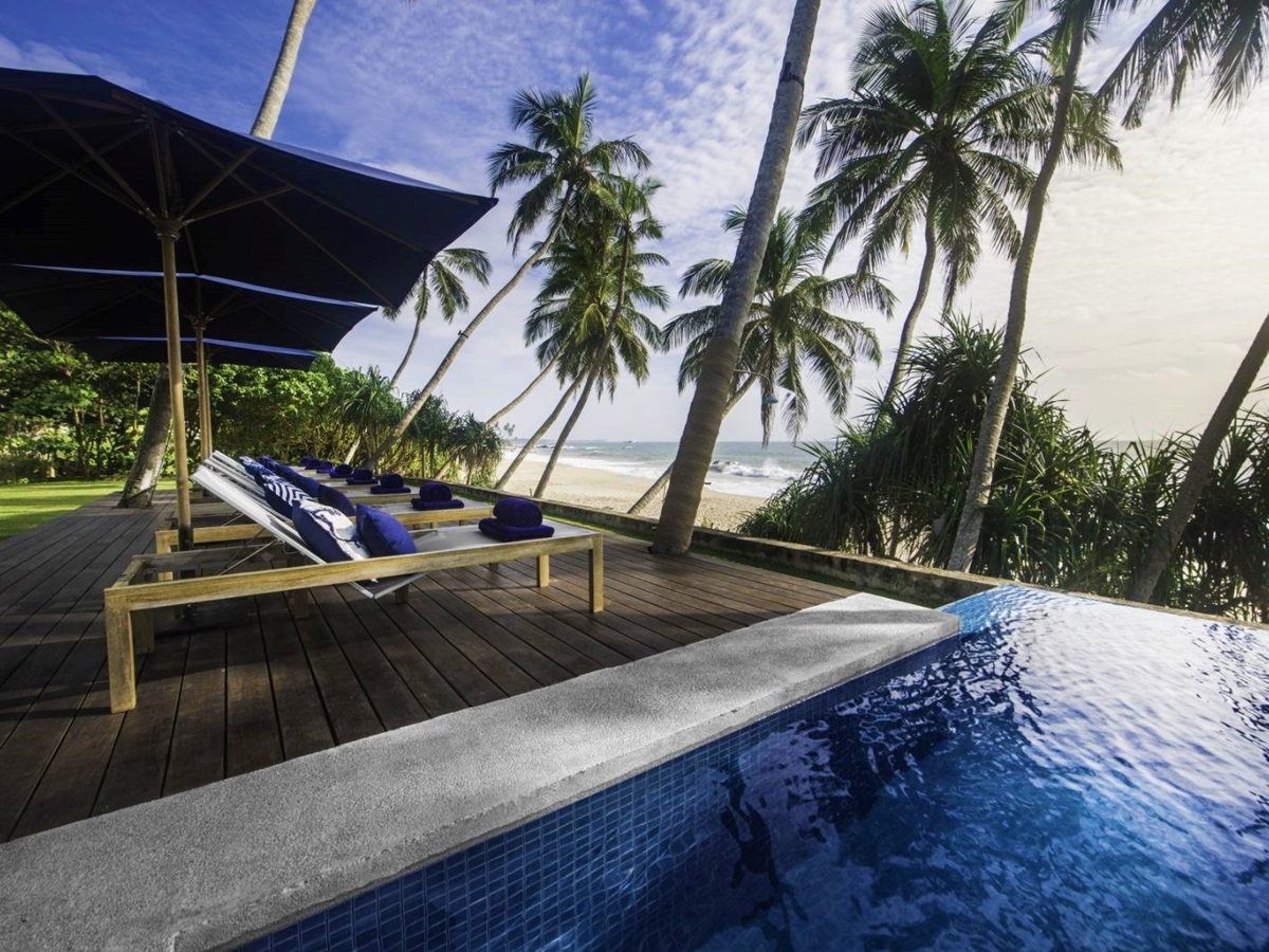 Poolside sunbeds at Kumu Beach on the south coast of Sri Lanka