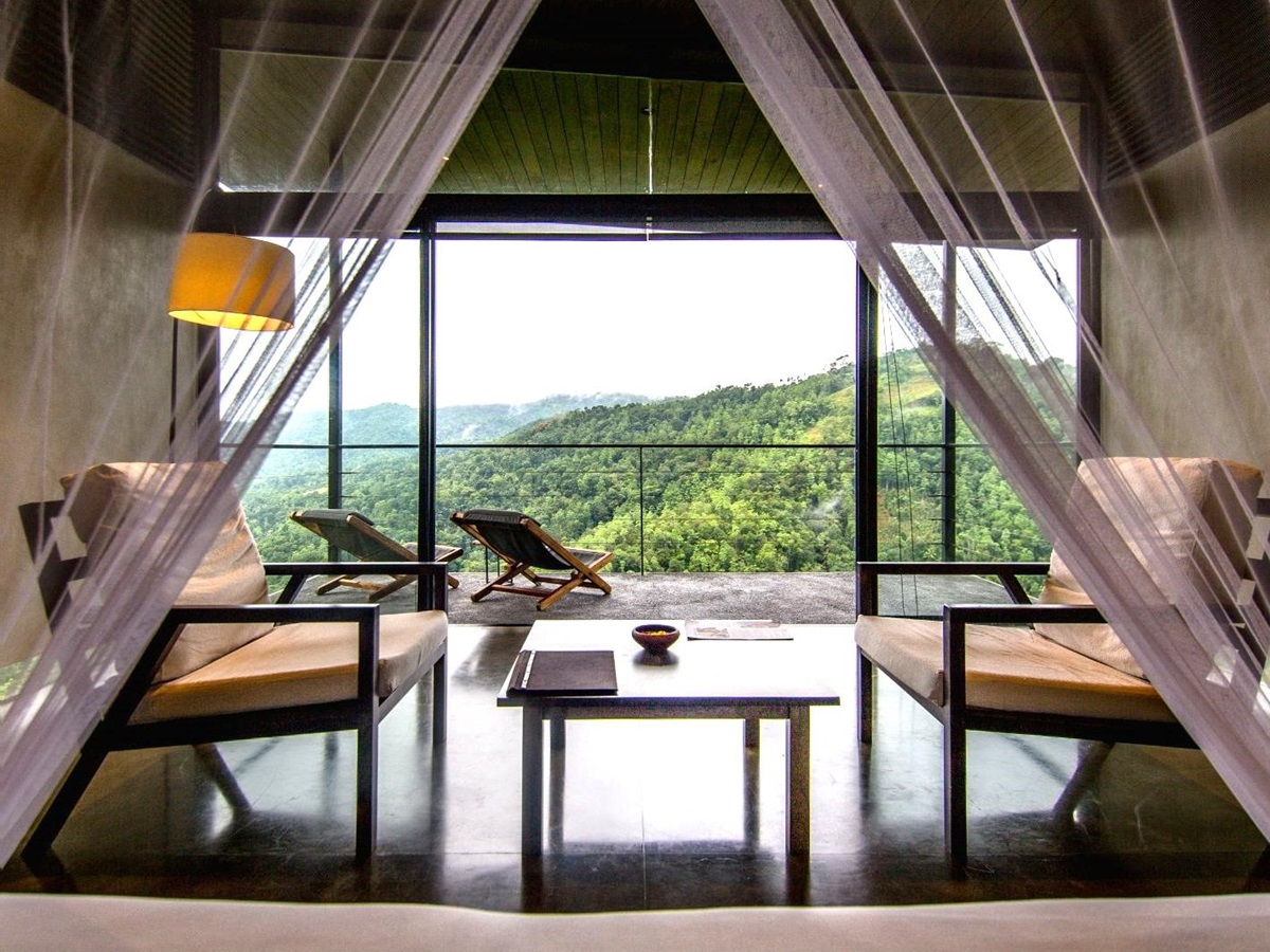 Interior and terrace of a Mountain View Chalet at Santani Wellness Resort in Sri Lanka