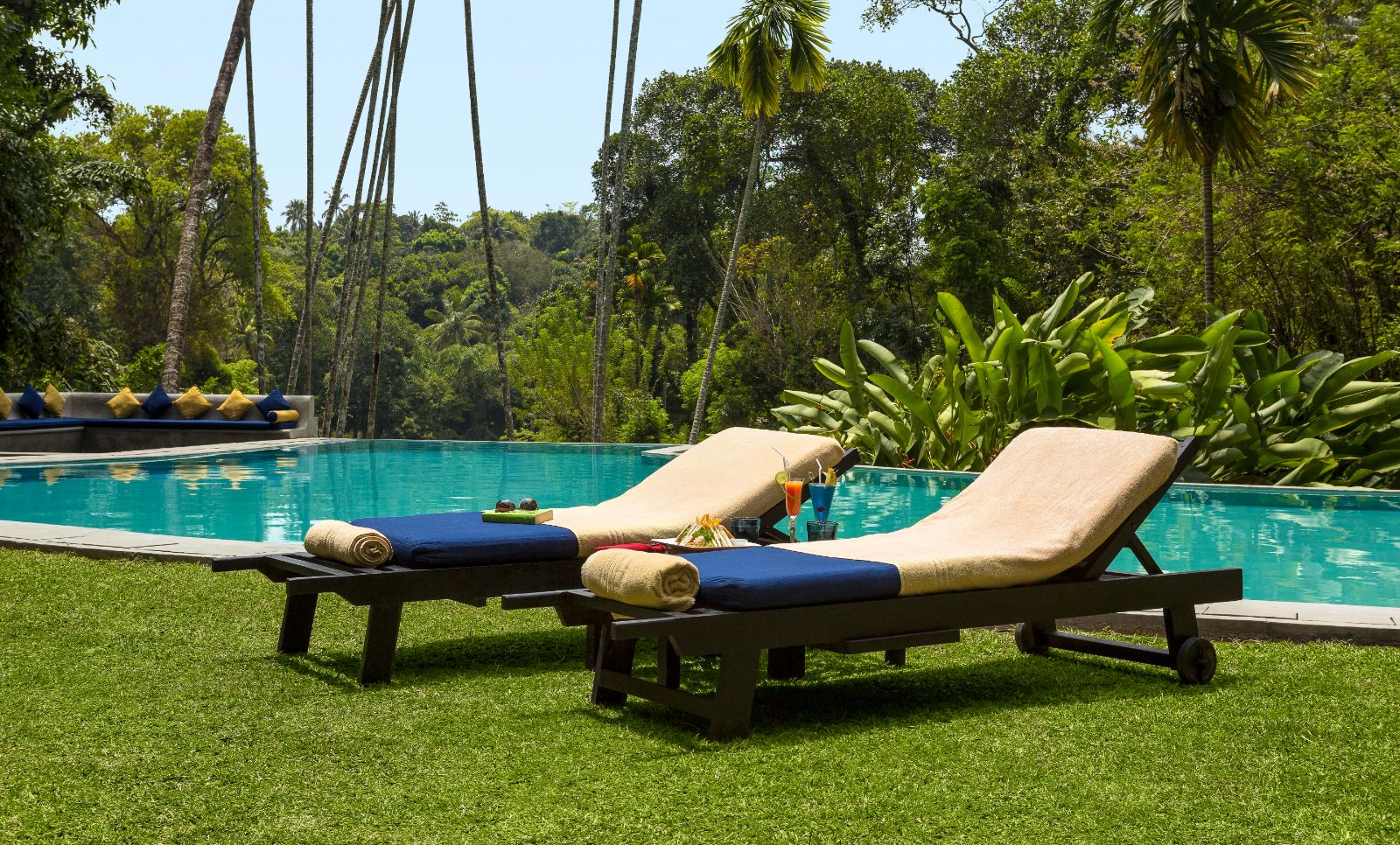 Poolside sunbeds at The kandy house in Sri Lanka