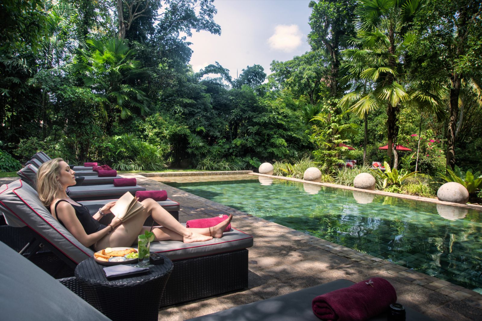 Sunbeds by the pool at The Wallawwa in Sri Lanka