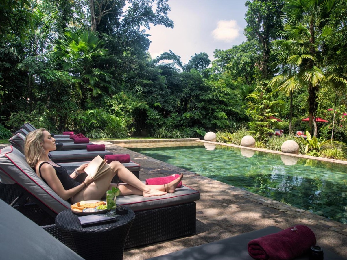 Sunbeds by the pool at The Wallawwa in Sri Lanka