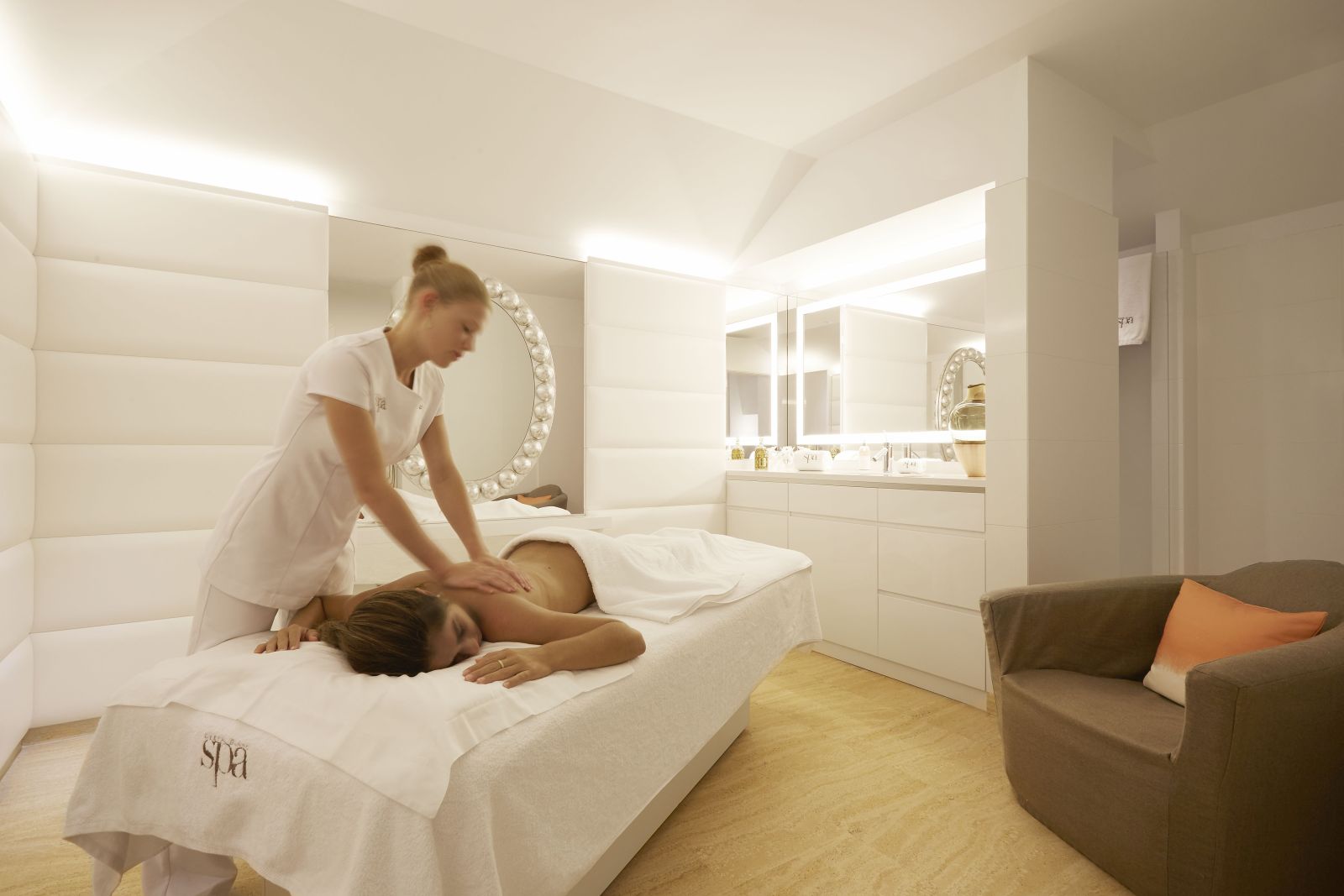 A lady having a massage in the spa at Hotel Cheval Blanc in St Barths