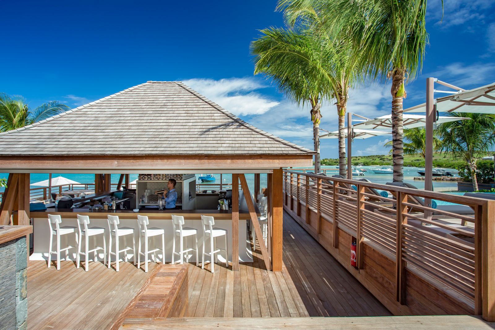 The outdoor bar overlooking the sea at Le Barthelemy Hotel & Spa in St Barths