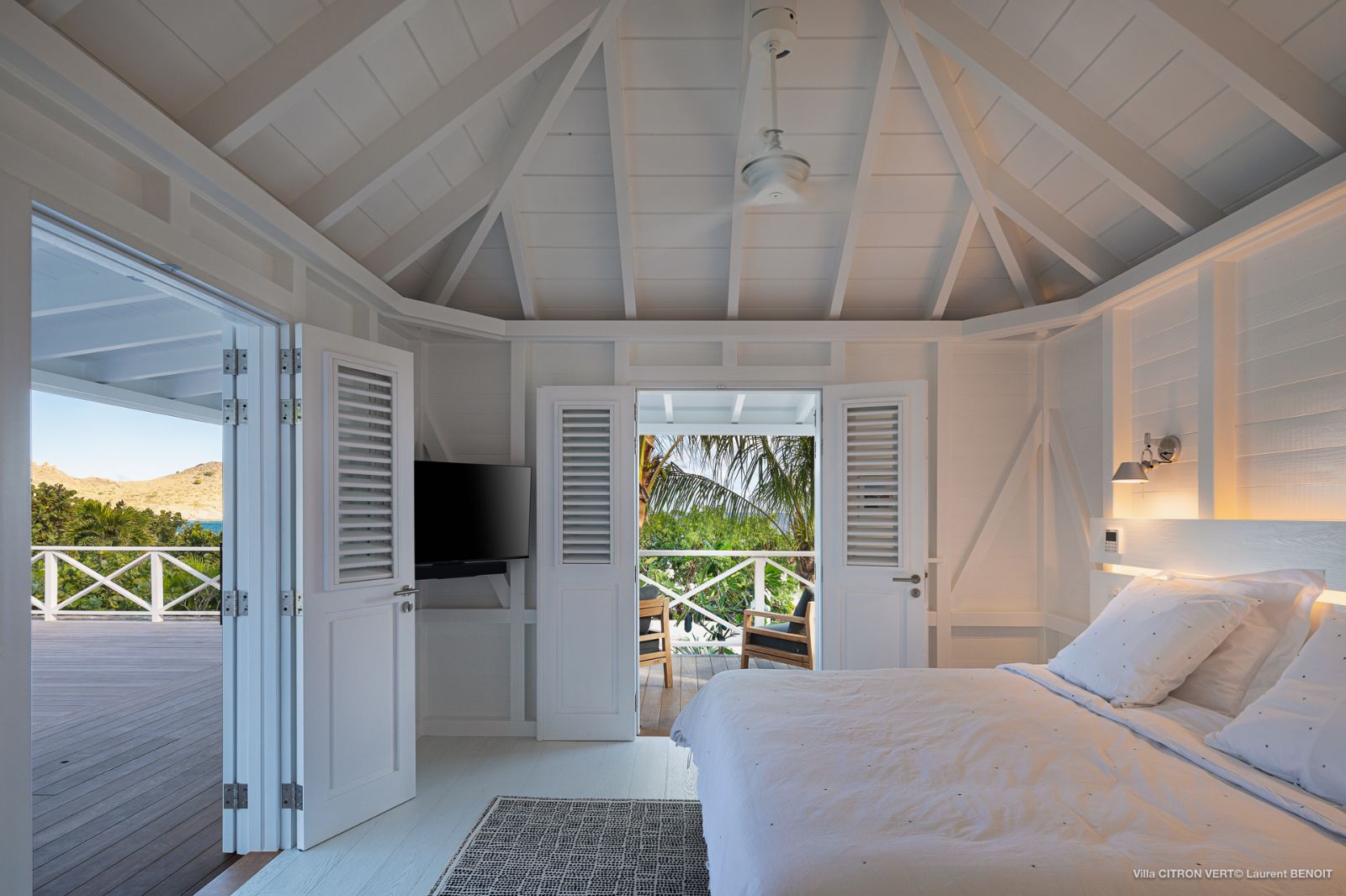 White bedroom with window at Villa La Palma in St Barths