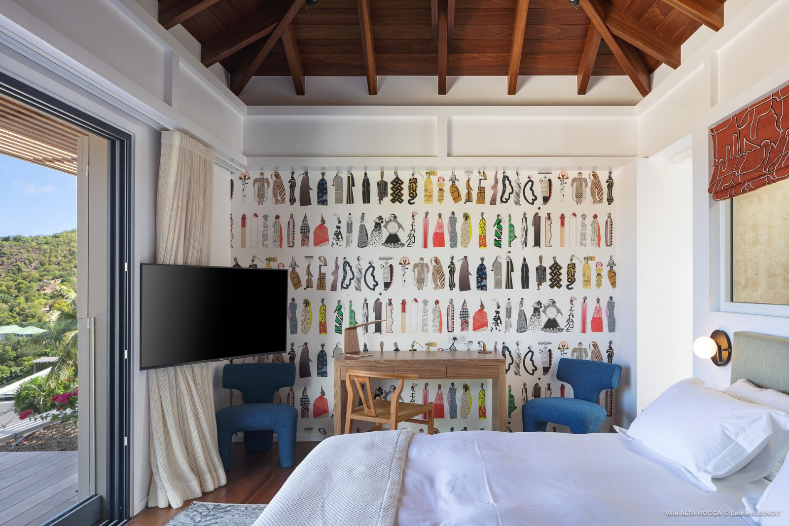bedroom with patterned wallpaper