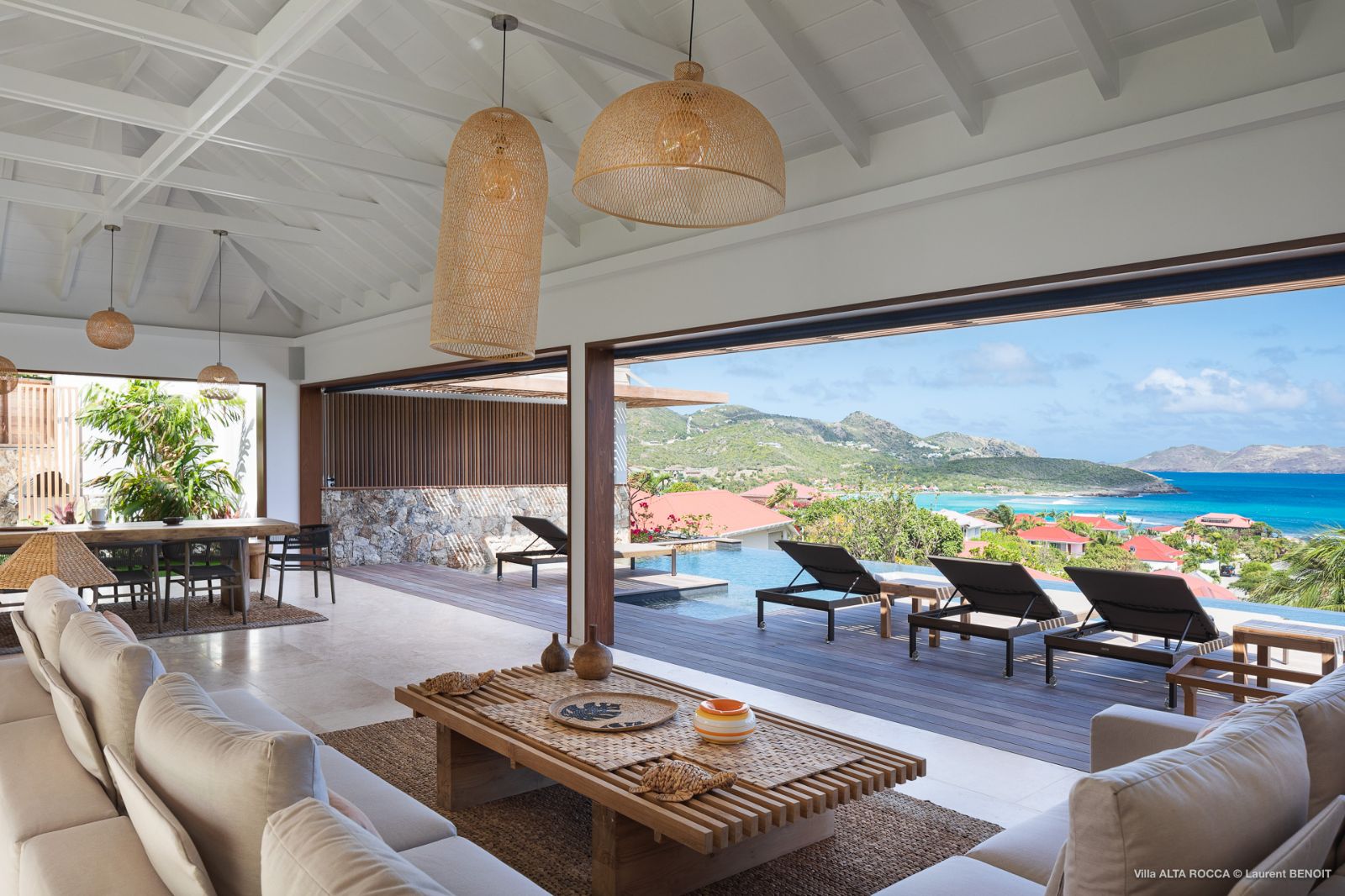 seating area with pool and sea view