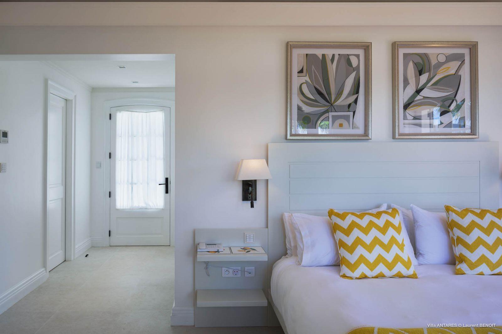 Villa Blanc, St Barths - white bedroom with yellow cushions