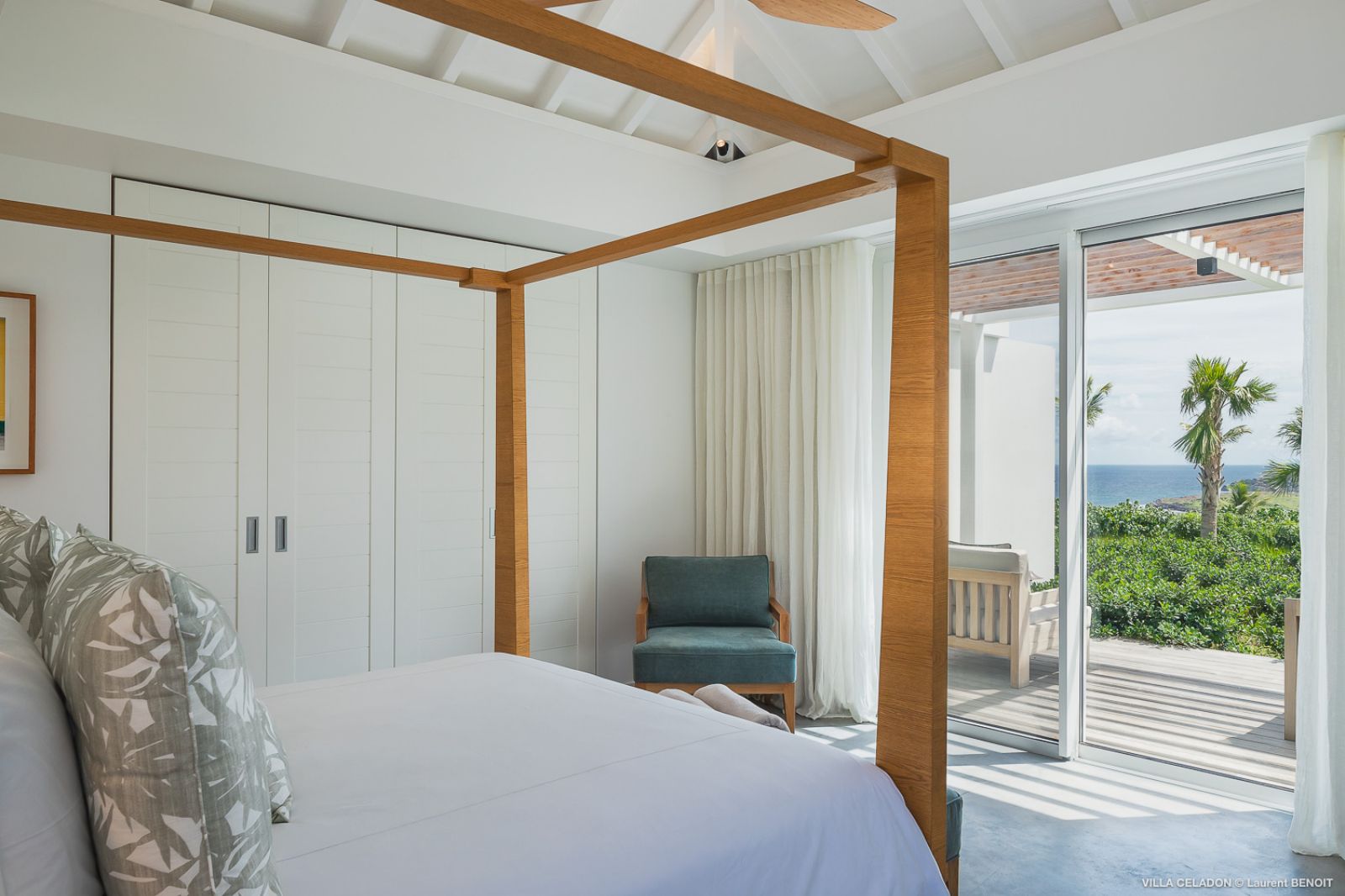 white four poster bed and door to terrace