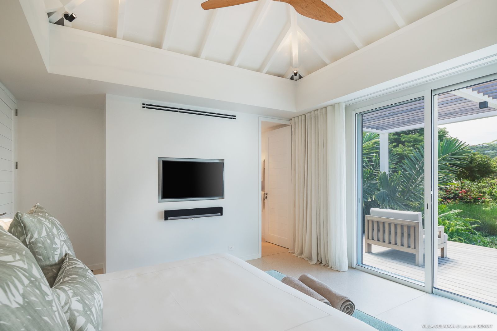 white bedroom with seaview