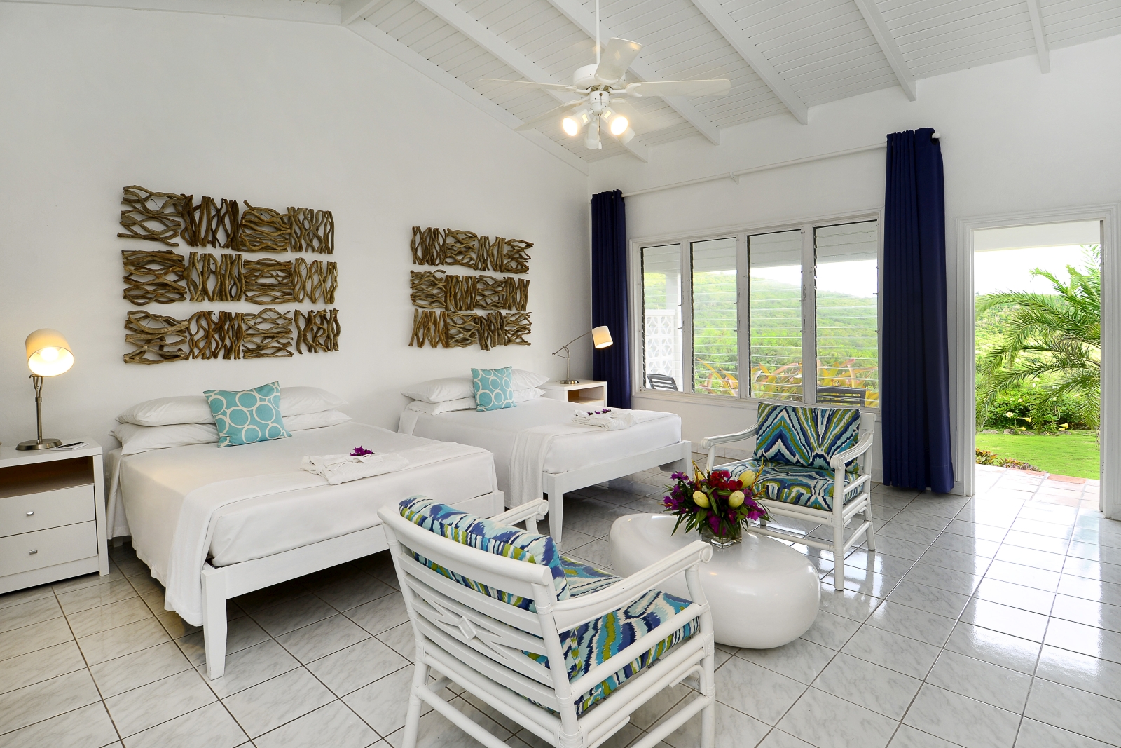 Plantation room with seating area and view of the garden at Montpelier Nevis