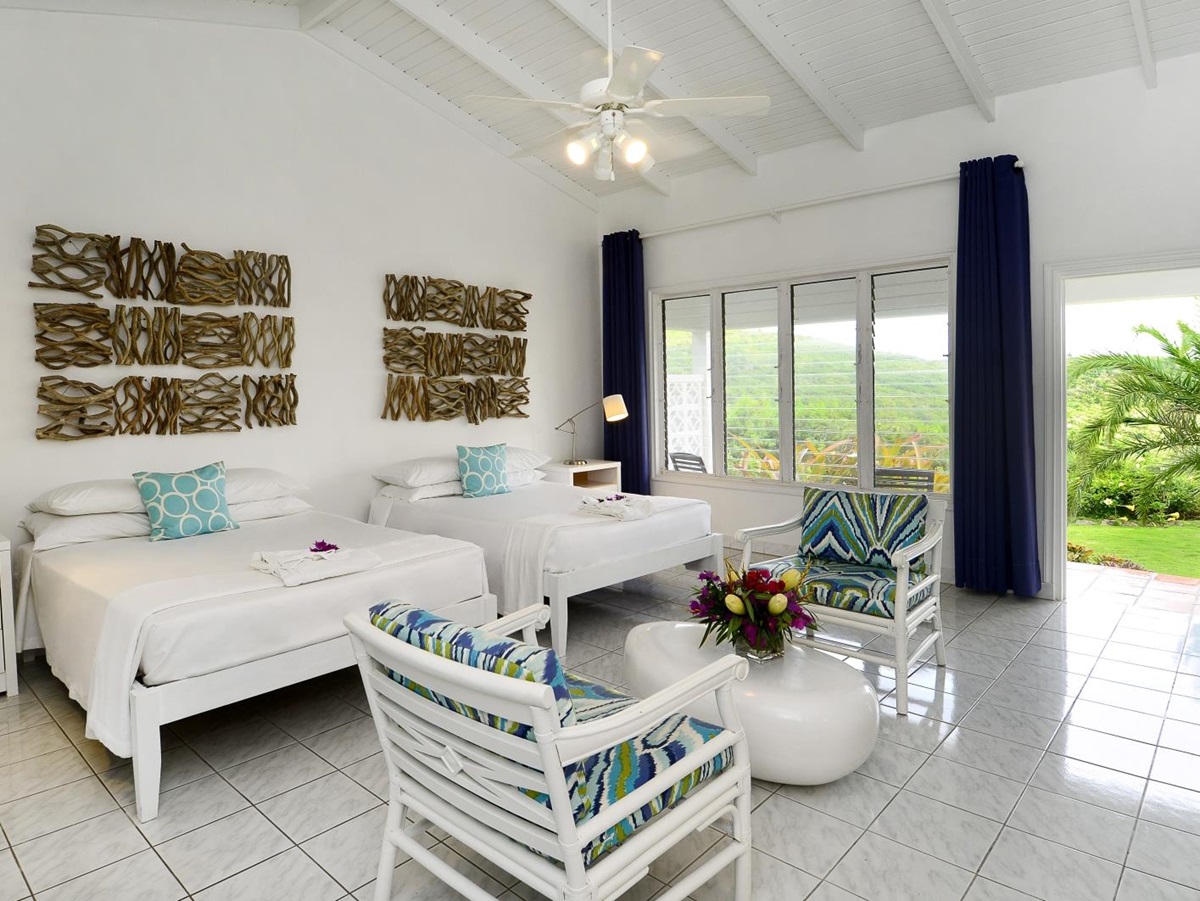 Plantation room with seating area and view of the garden at Montpelier Nevis