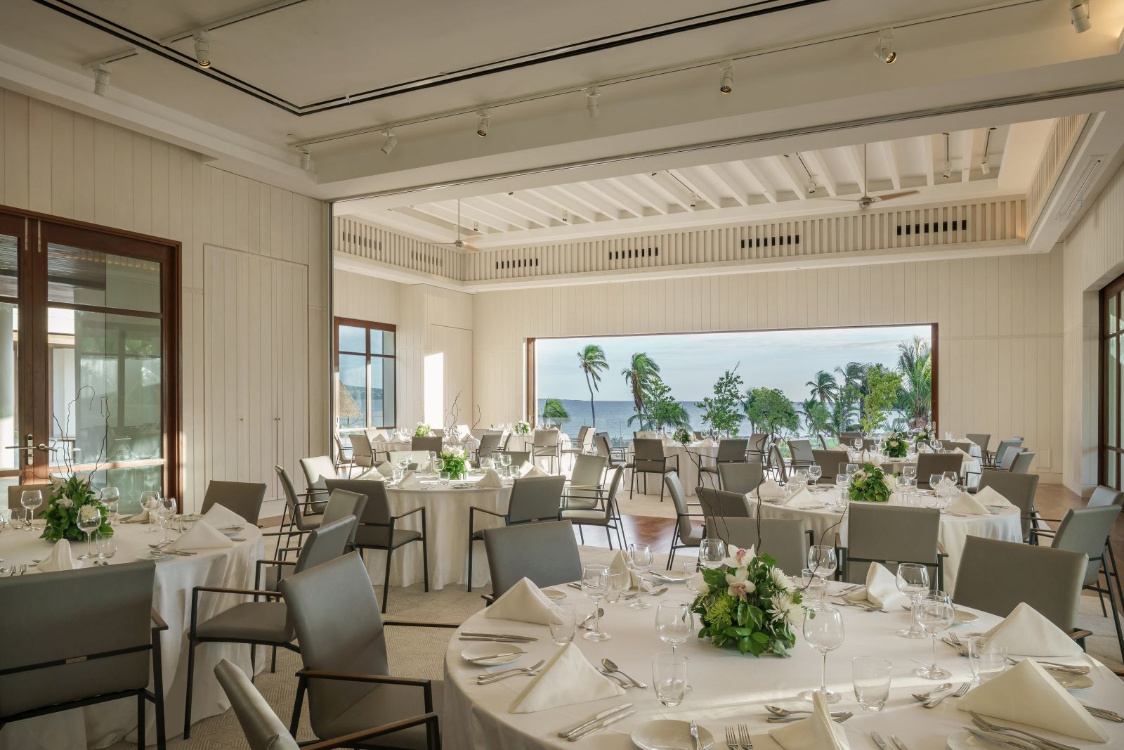 The dining room overlooking the sea at the Park Hyatt St. Kitts Christophe Harbour Hotel