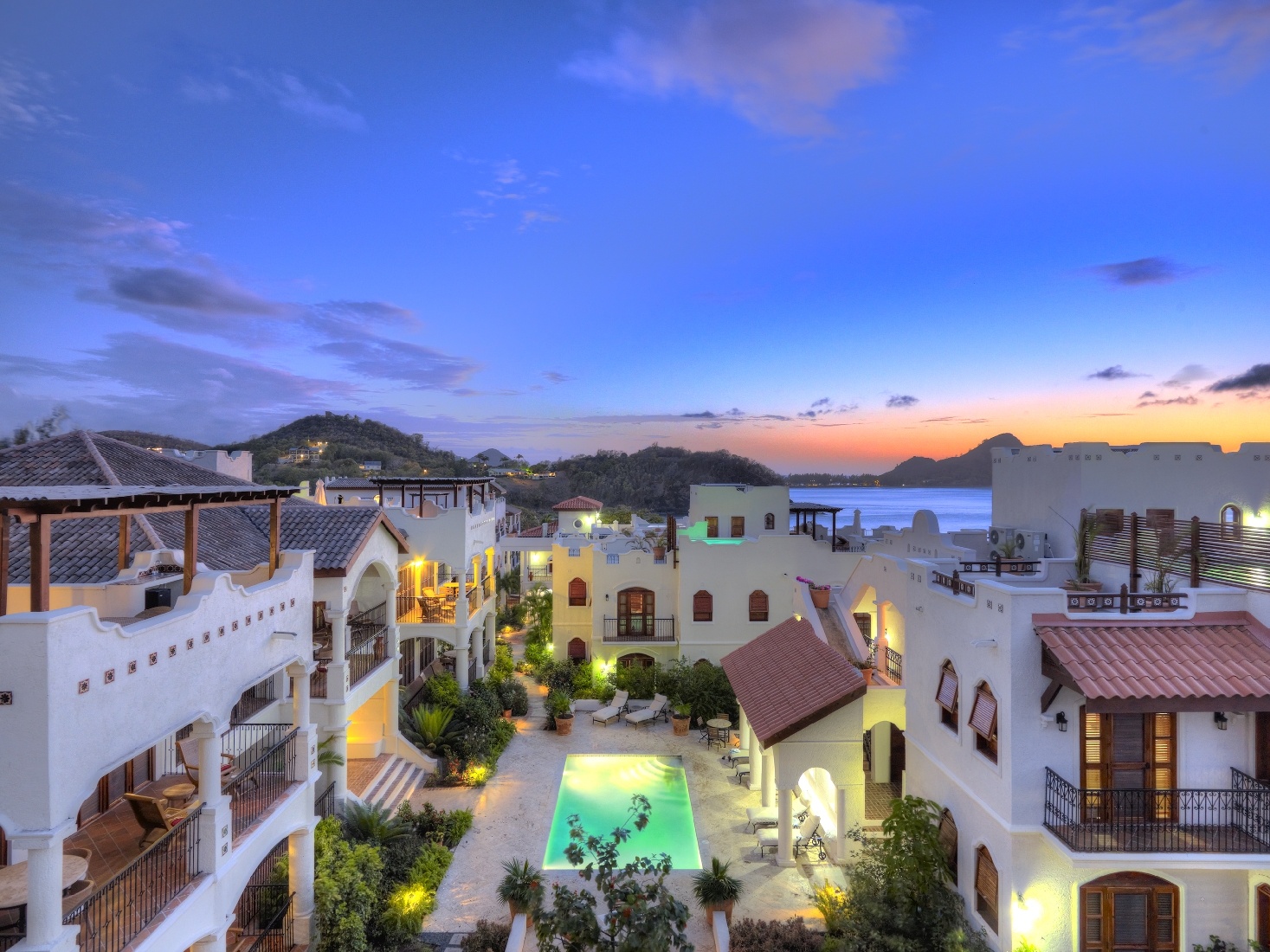 The courtyard with swimming pool of Cap Maison, St. Lucia, at night