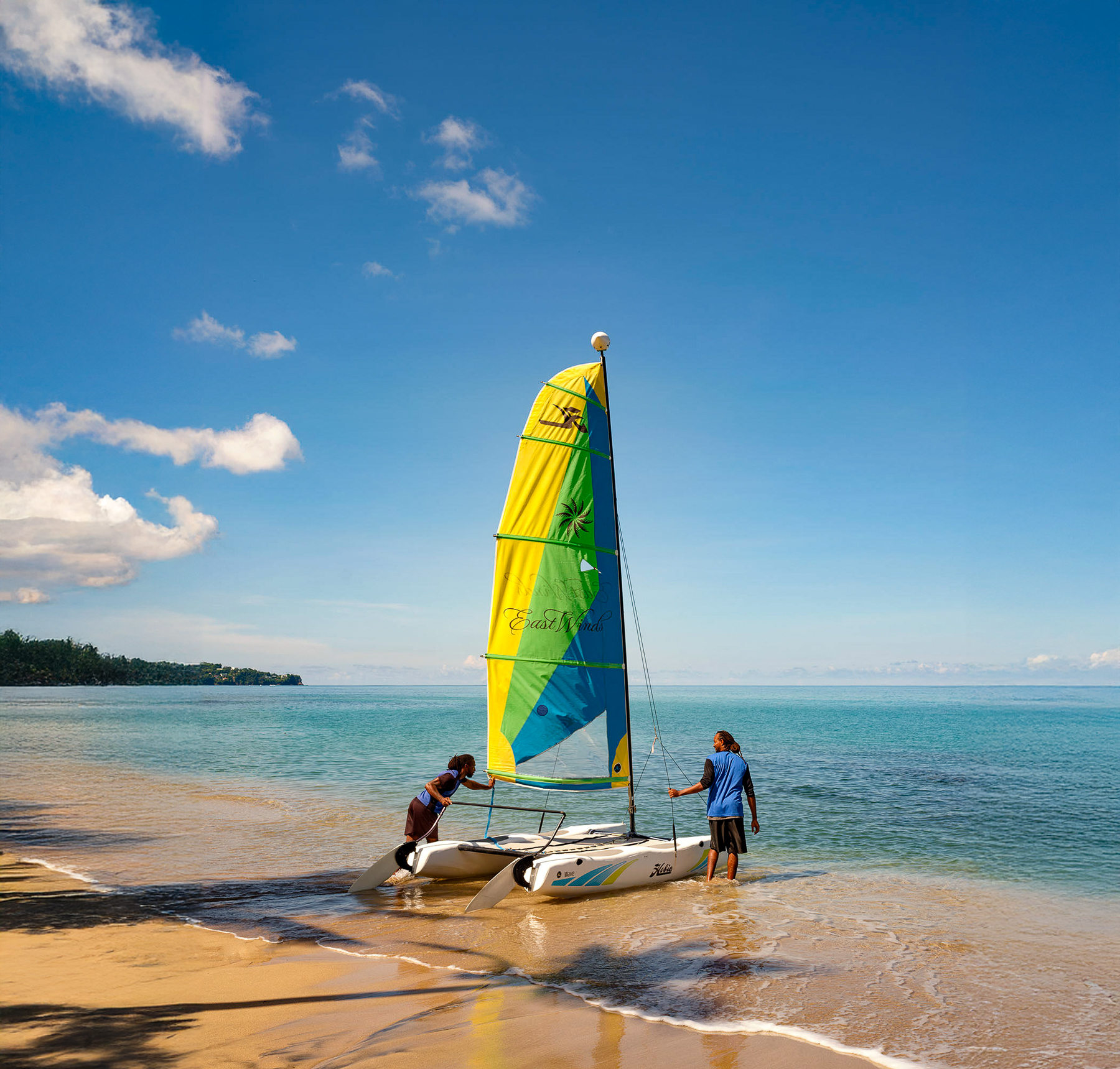 A sailing catamaran on the beach at East Winds luxury Resort in St Lucia