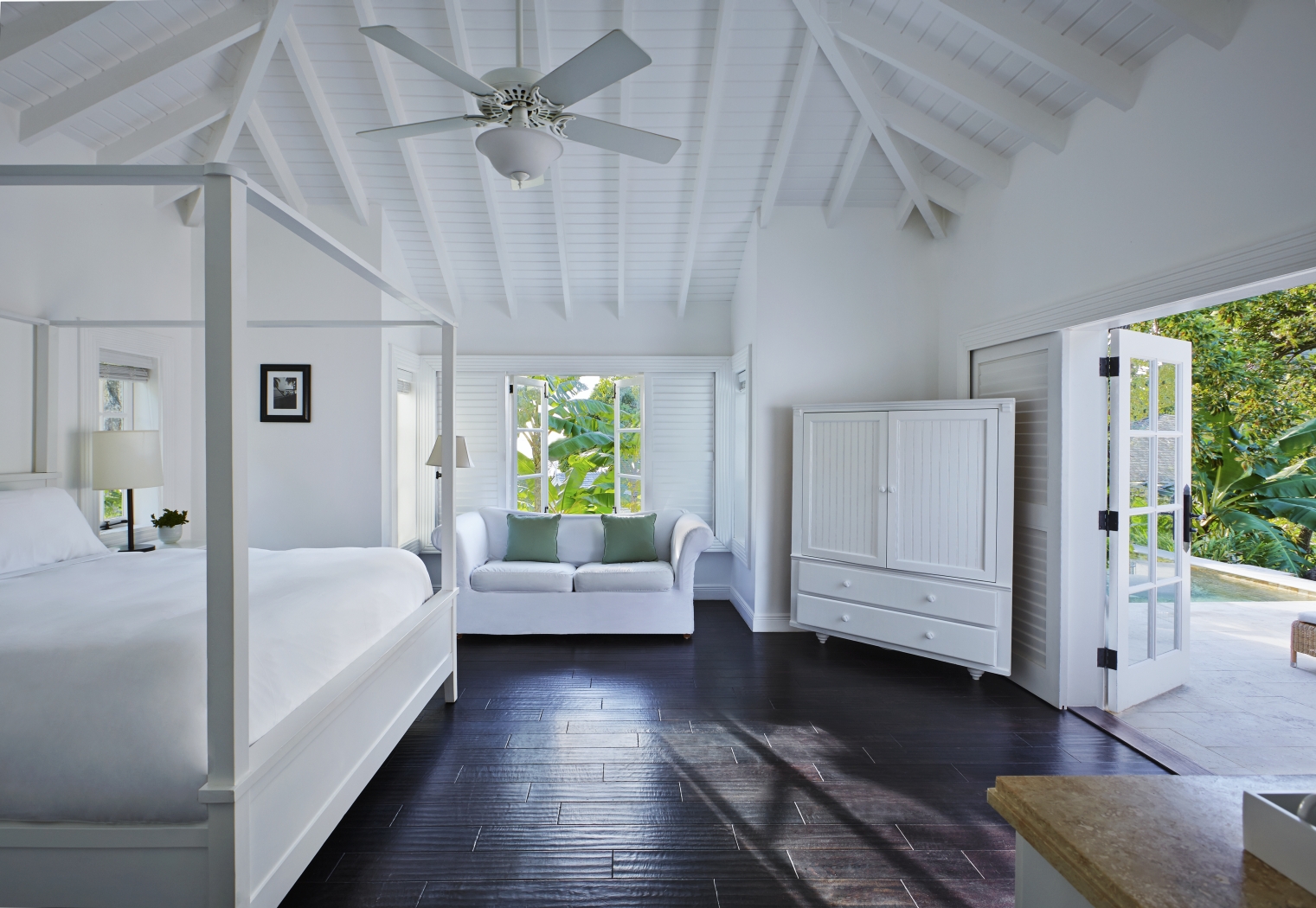 A double bedroom of a Luxury Cottage at The deck of a Superior Luxury Cottage at Sugar Beach, St Lucia