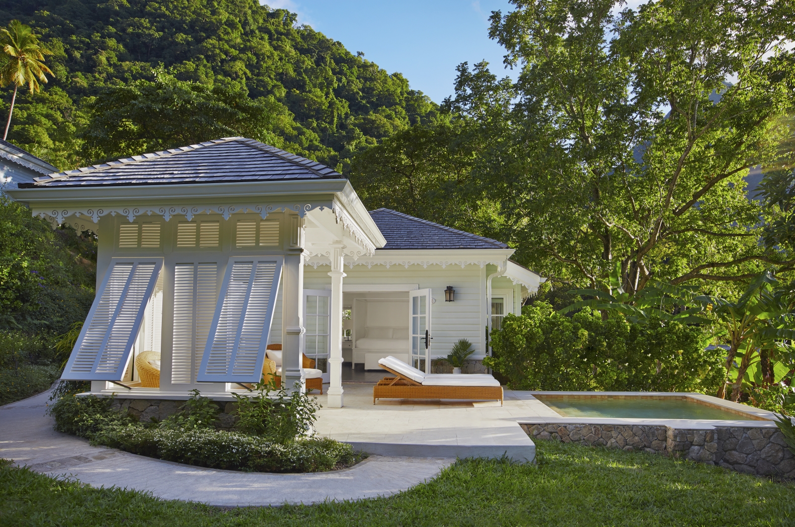 Exterior of a luxury cottage at The deck of a Superior Luxury Cottage at Sugar Beach, St Lucia