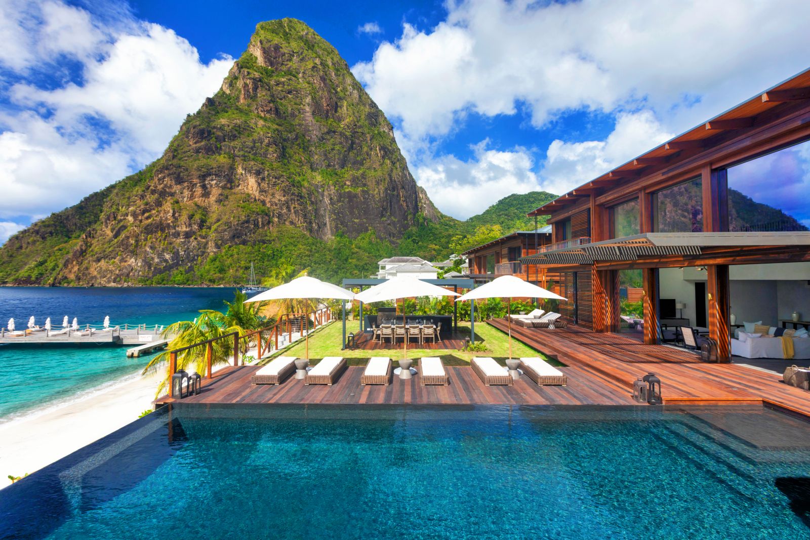 Swimming pool at Sugar Beach St Lucia with backdrop of the Pitons