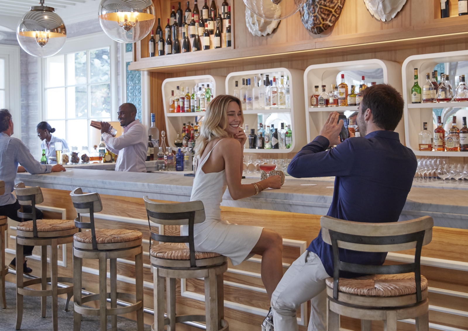 Two people enjoying a drink at the Turtles Bar