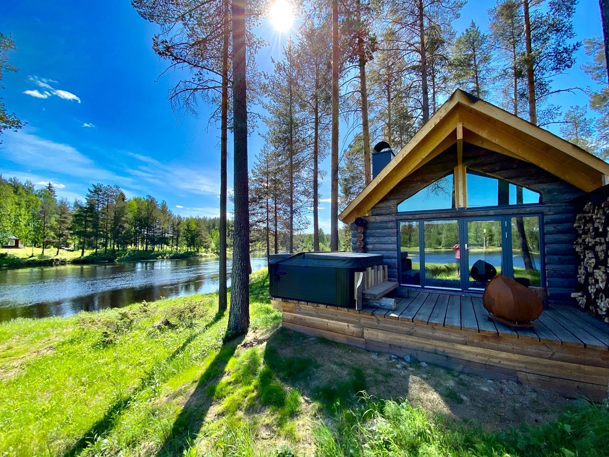 Exterior view of a guest cabin at Arctic Retreat in Swedish Lapland during summer