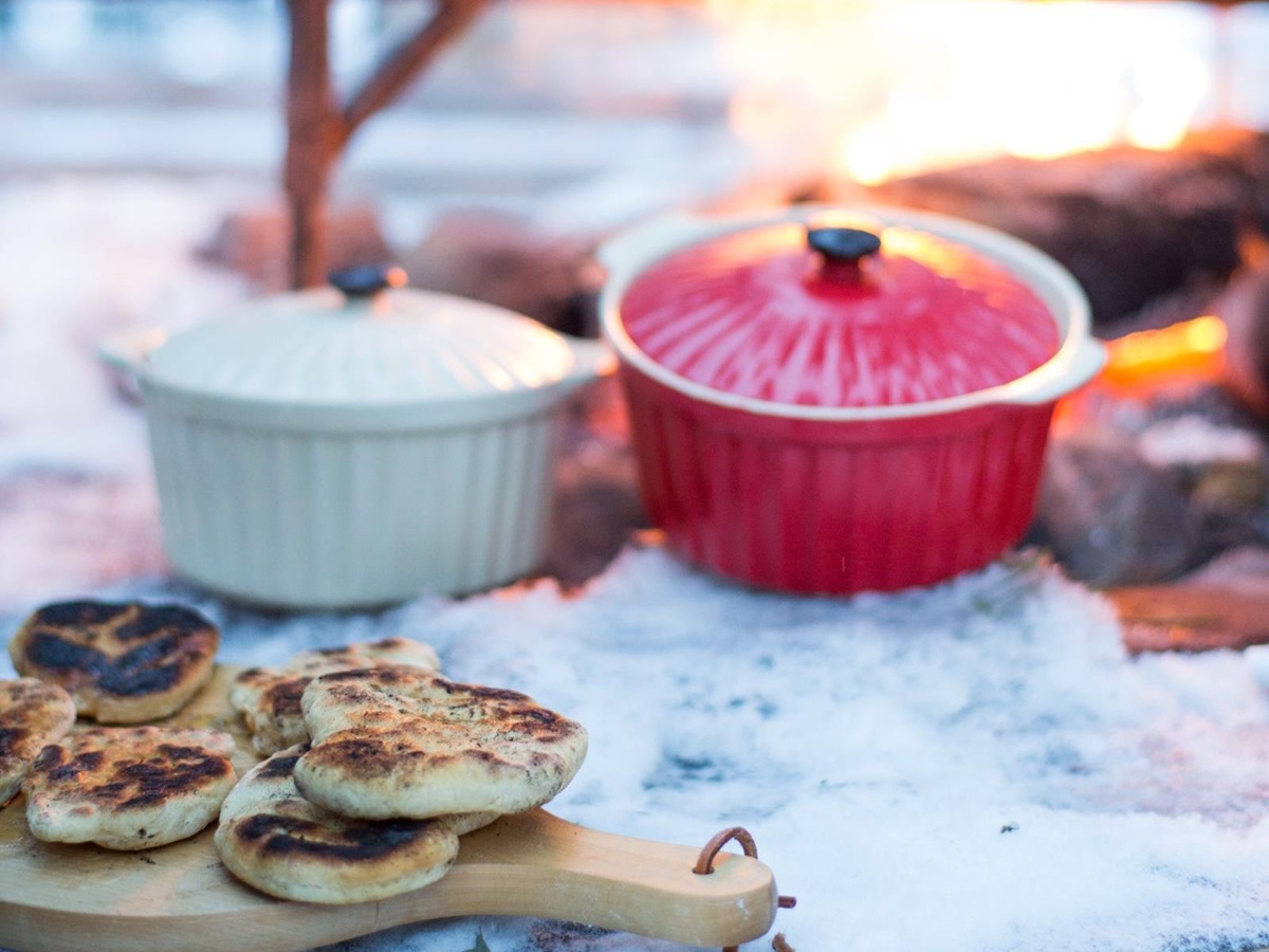 Outdoor cooking during a stay at Aurora Safari Camp in Sweden