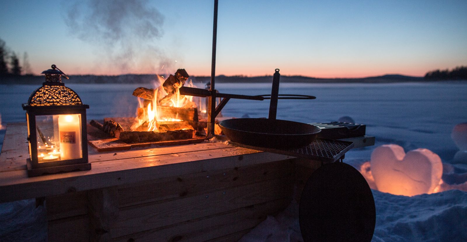 Bonfire on the ice at Aurora Safari Camp in Sweden