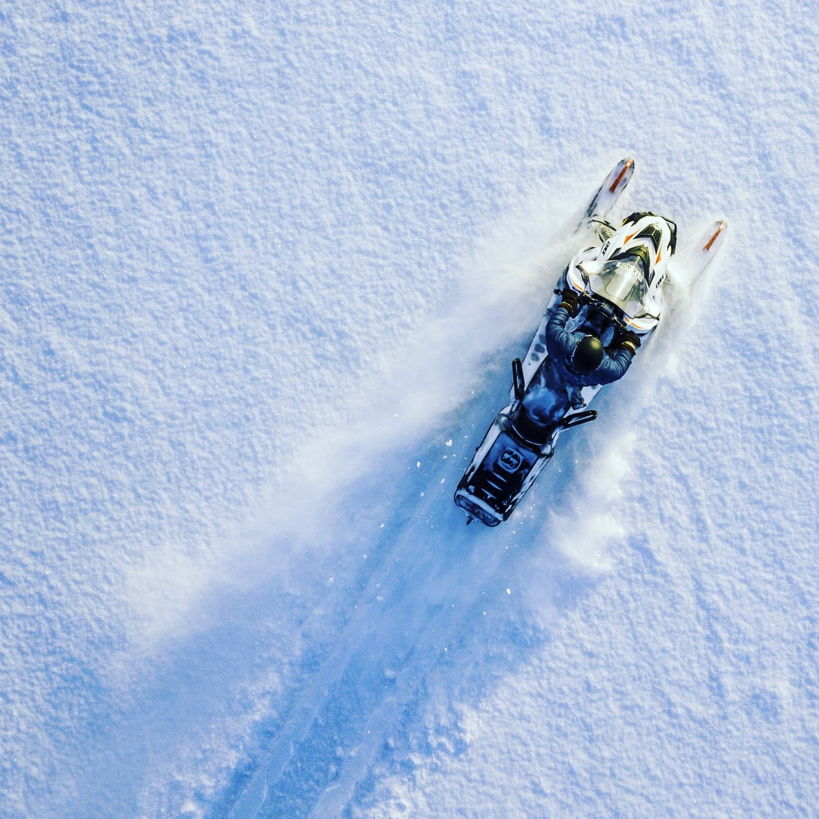 Aerial view of a snowmobile in the snow at Aurora Safari Camp in Sweden