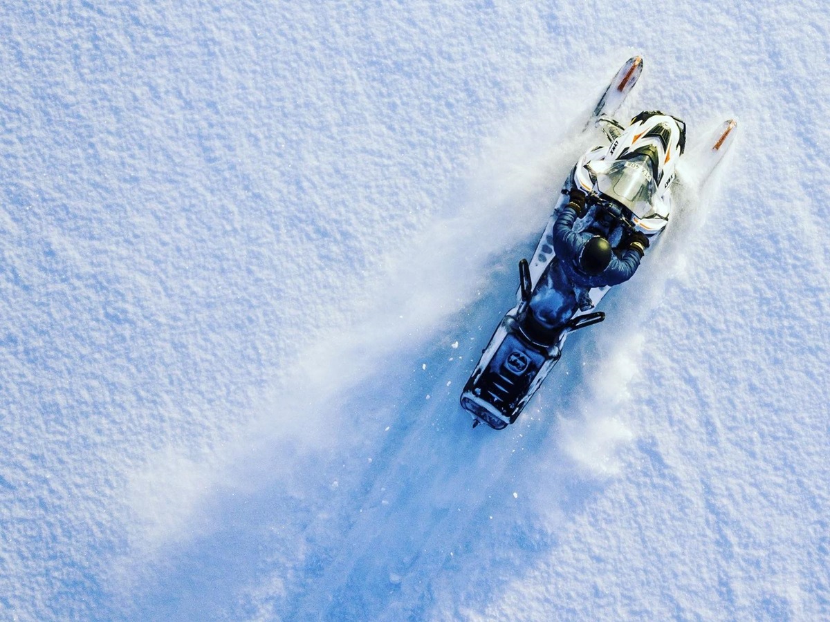 Aerial view of a snowmobile in the snow at Aurora Safari Camp in Sweden
